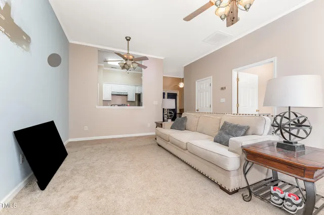 a living room with furniture bathtub and a chandelier