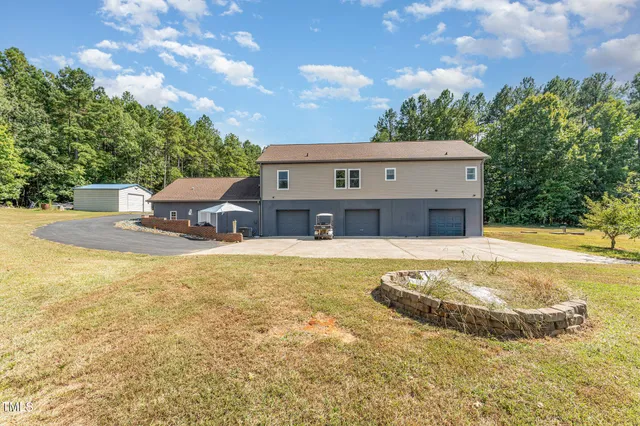 a view of house with outdoor space and swimming pool