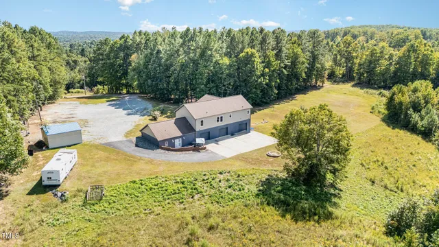 a view of a backyard with swimming pool
