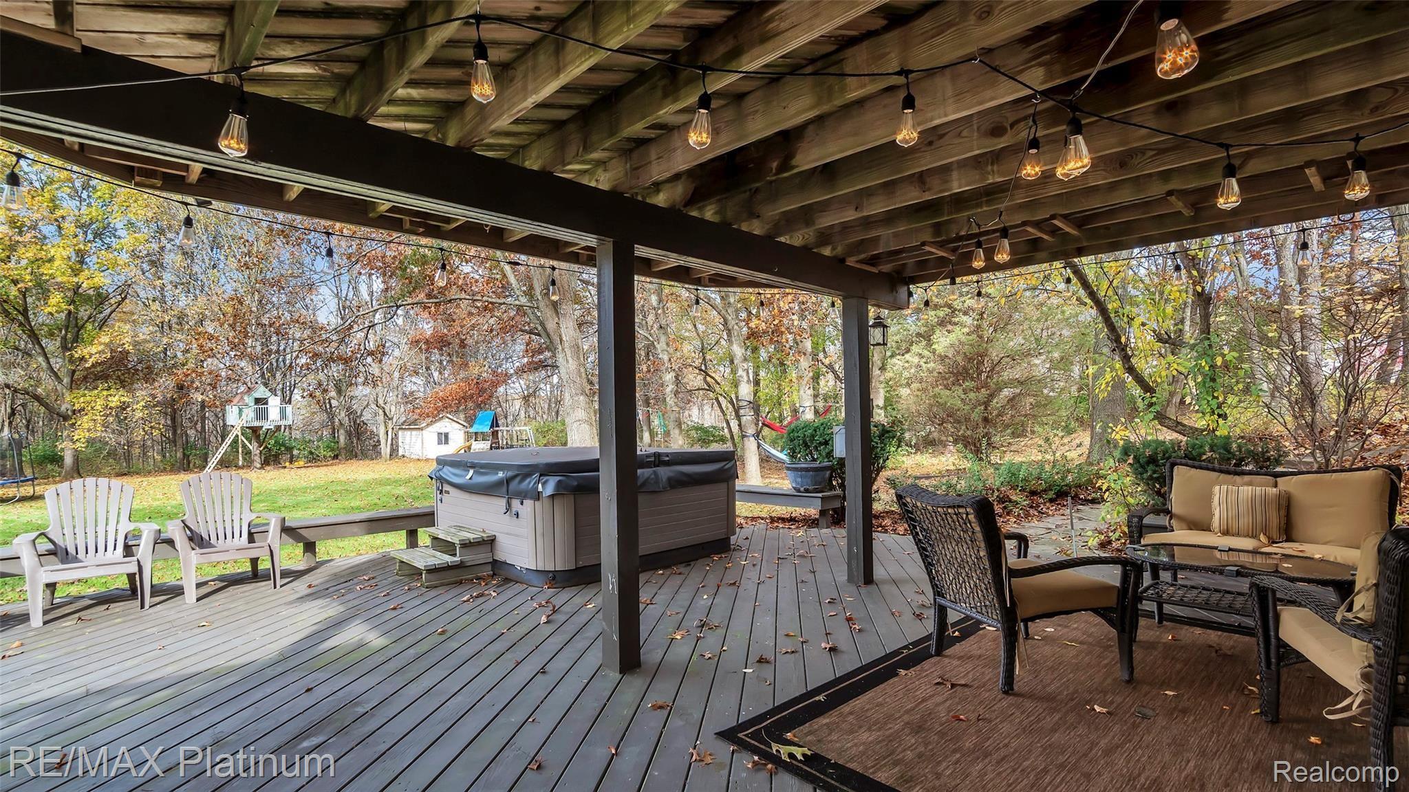 2439 Sunny Ridge Drive Pinckney, MI 48169 - Photo 31 of 42 Large Private Deck For Relaxation