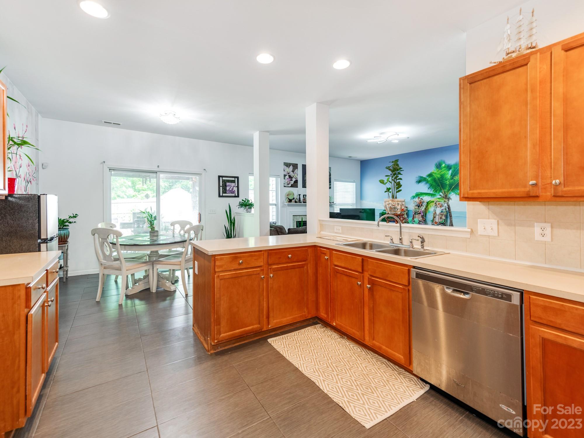 4409 Lawrence Daniel Drive Matthews, NC 28104 - Photo 14 of 38 a kitchen with stainless steel appliances granite countertop sink a microwave counter space and a window