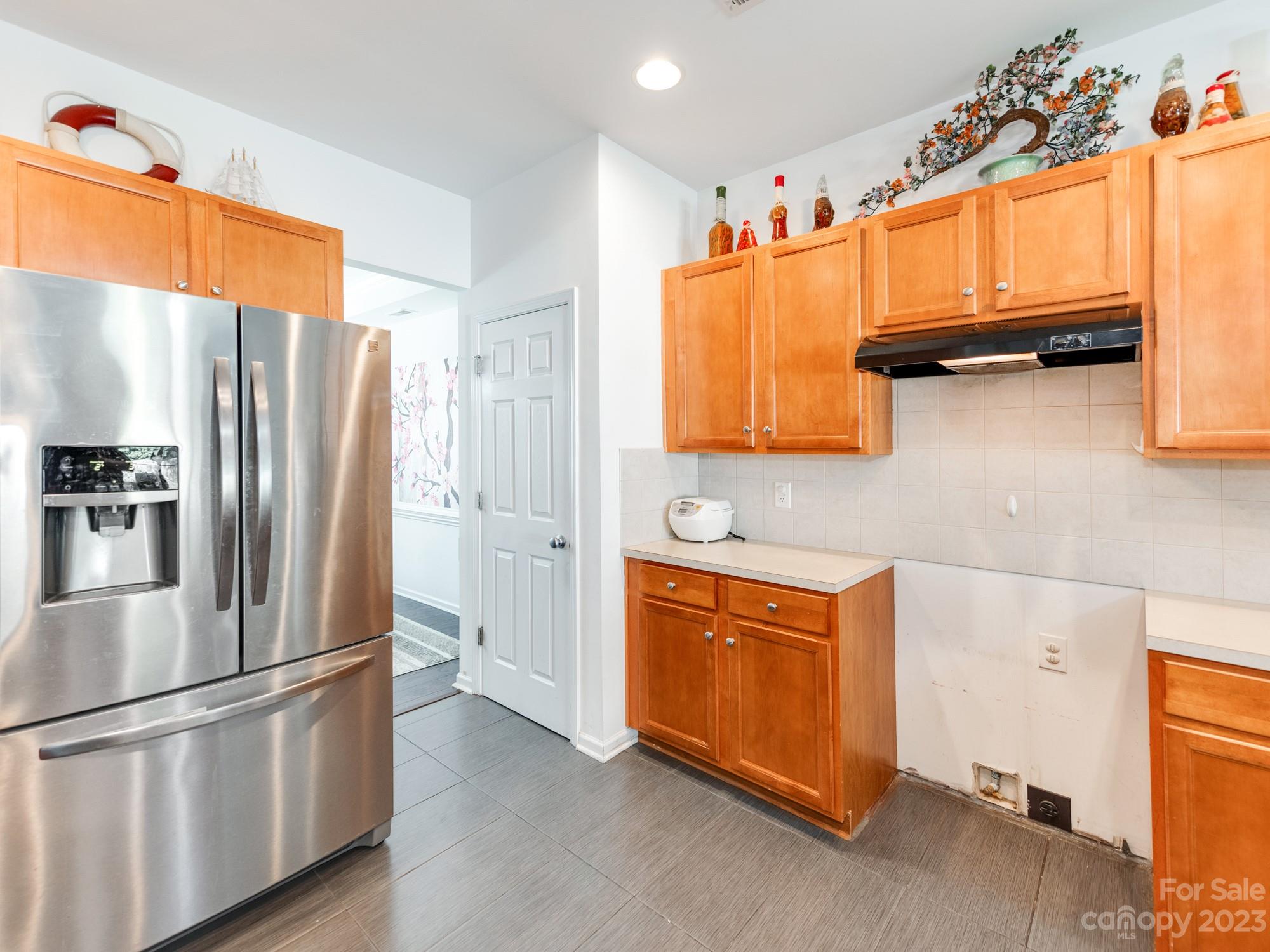 4409 Lawrence Daniel Drive Matthews, NC 28104 - Photo 16 of 38 a kitchen with stainless steel appliances granite countertop a refrigerator a stove and a sink