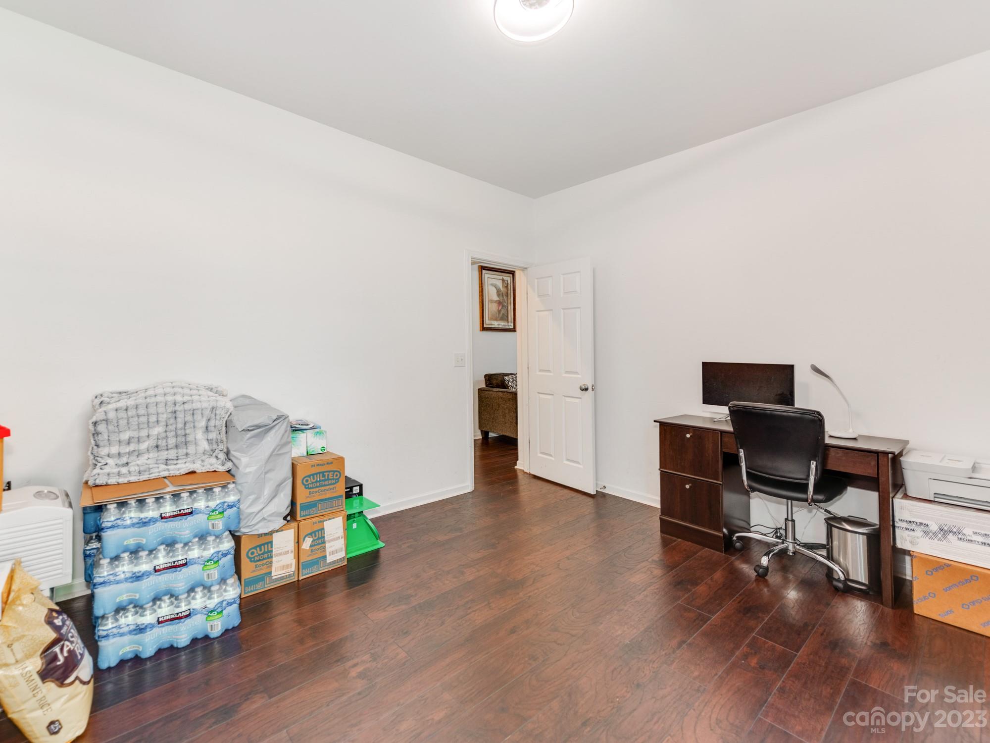 4409 Lawrence Daniel Drive Matthews, NC 28104 - Photo 18 of 38 a view of a workspace with furniture and wooden floor