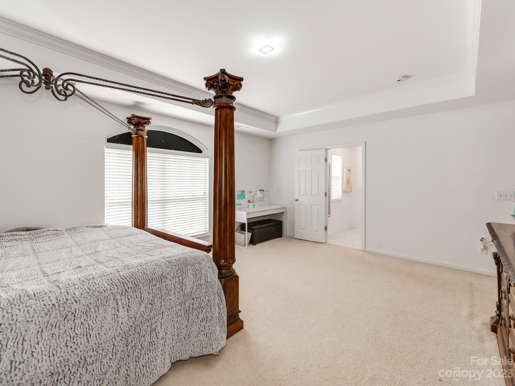 4409 Lawrence Daniel Drive Matthews, NC 28104 - Photo 22 of 38 a spacious bedroom with a bed and a window