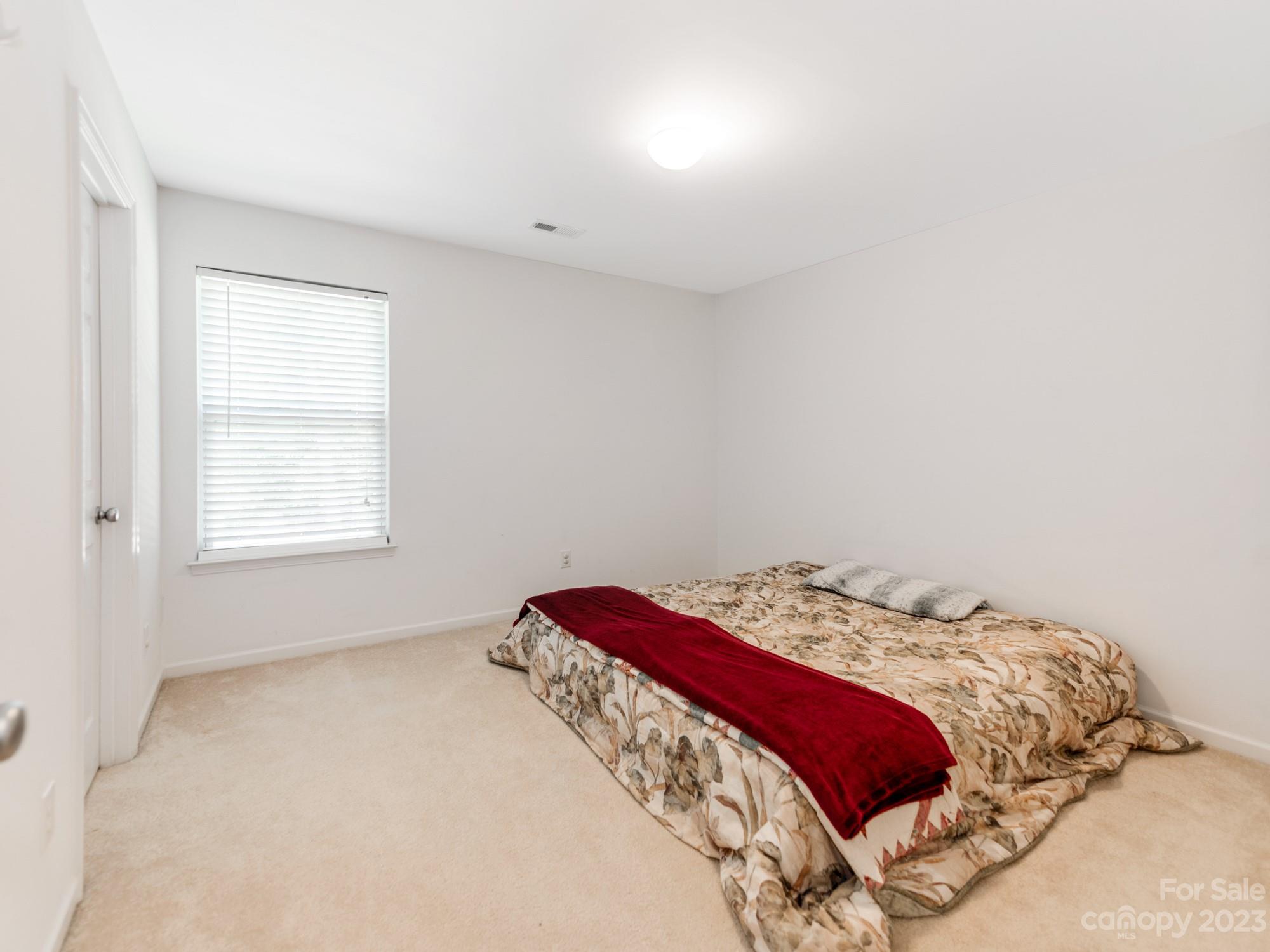 4409 Lawrence Daniel Drive Matthews, NC 28104 - Photo 26 of 38 a bedroom with a bed and a window