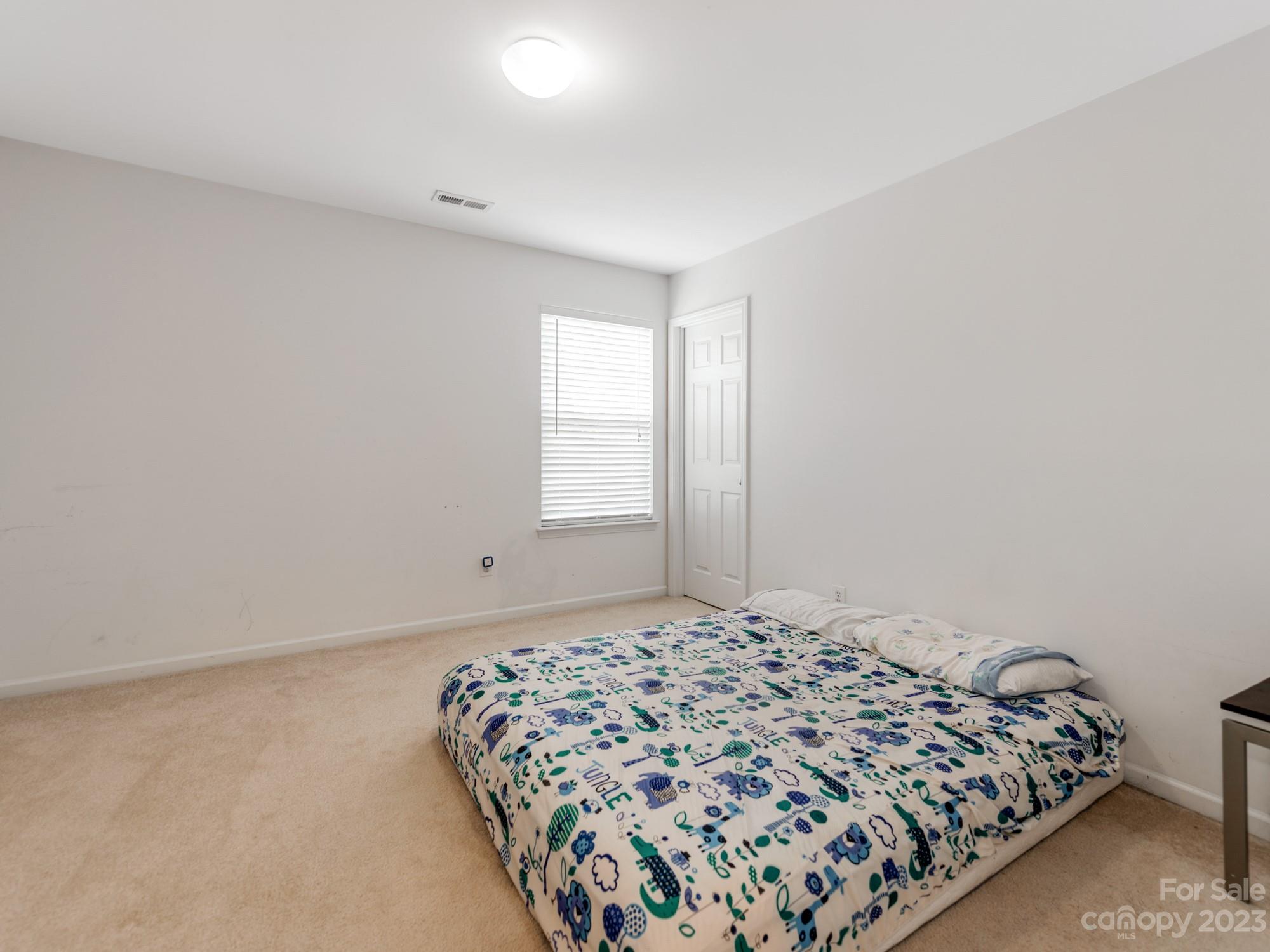 4409 Lawrence Daniel Drive Matthews, NC 28104 - Photo 28 of 38 a bedroom with a bed and a window