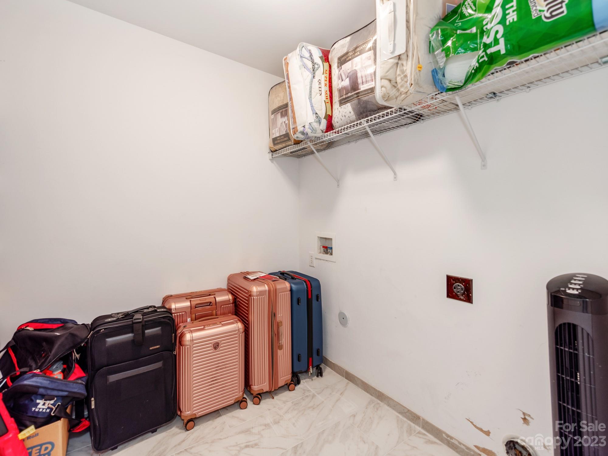 4409 Lawrence Daniel Drive Matthews, NC 28104 - Photo 33 of 38 a view of storage and utility room with washer and dryer