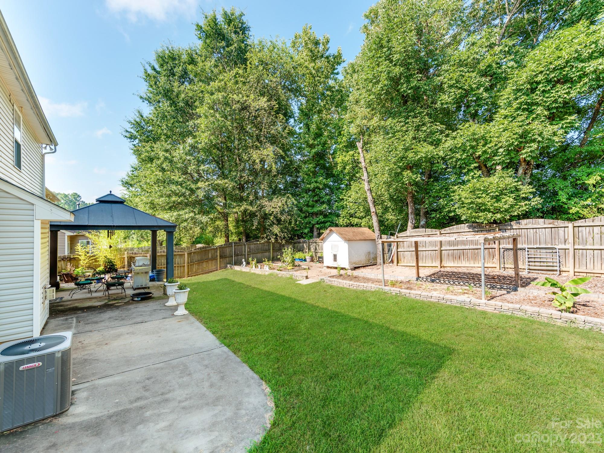4409 Lawrence Daniel Drive Matthews, NC 28104 - Photo 35 of 38 a view of a house with backyard and porch