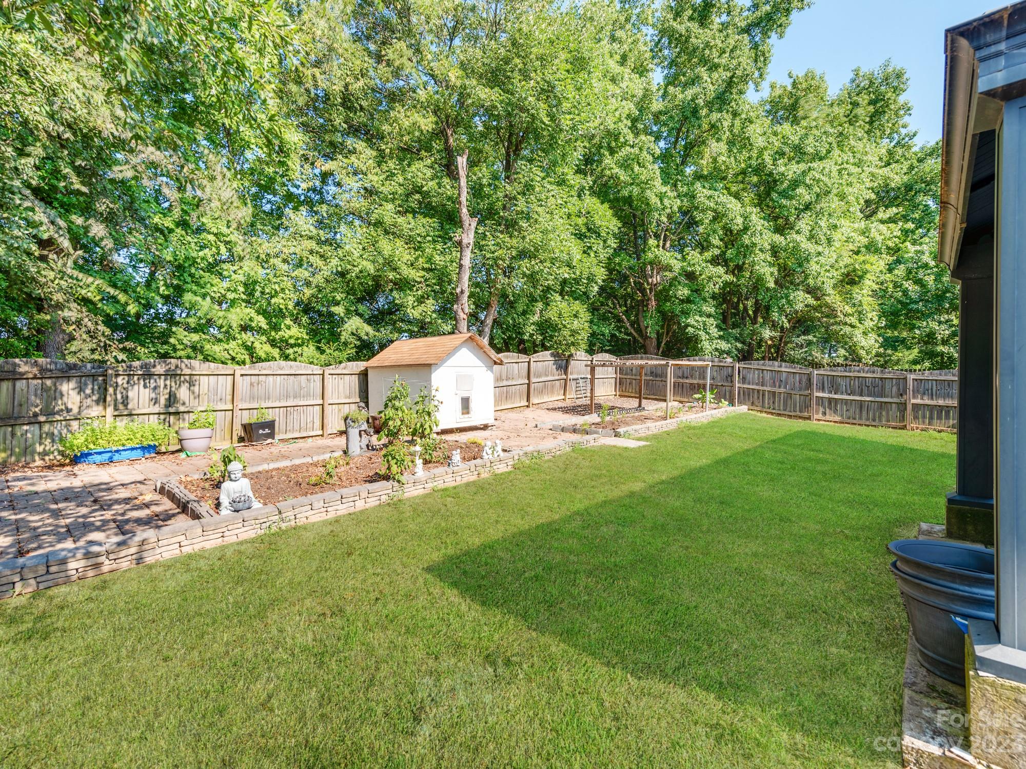 4409 Lawrence Daniel Drive Matthews, NC 28104 - Photo 36 of 38 a view of a chair and table in the garden