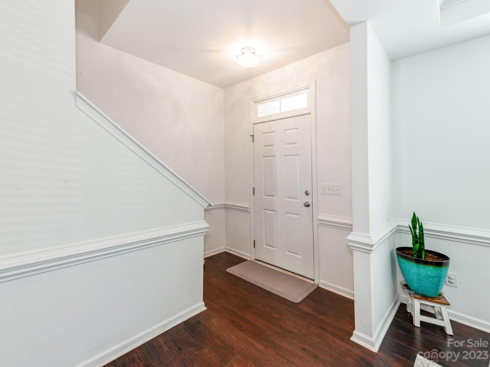 4409 Lawrence Daniel Drive Matthews, NC 28104 - Photo 5 of 38 a view of an entryway with wooden floor