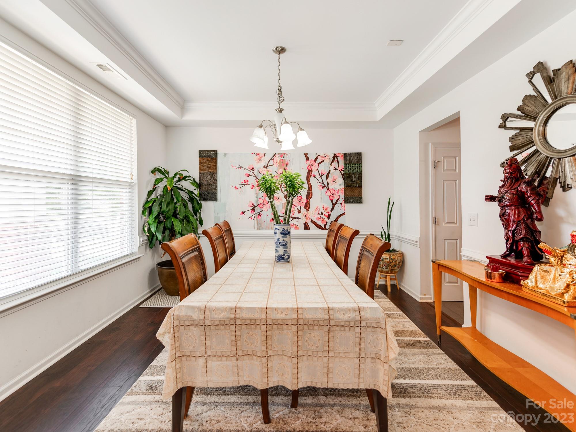 4409 Lawrence Daniel Drive Matthews, NC 28104 - Photo 6 of 38 a view of a dining room with furniture window and wooden floor