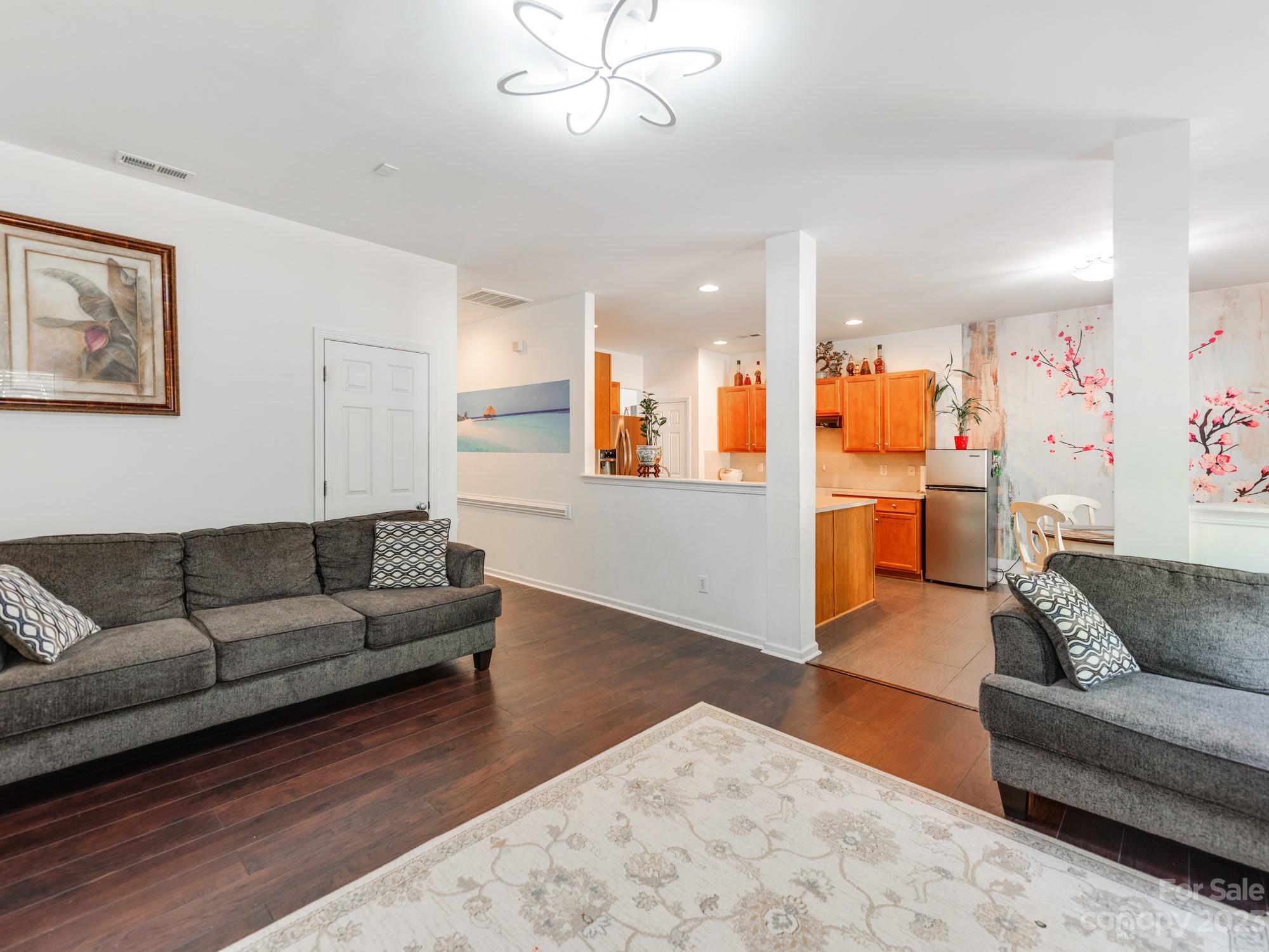 4409 Lawrence Daniel Drive Matthews, NC 28104 - Photo 10 of 38 a living room with furniture and kitchen view