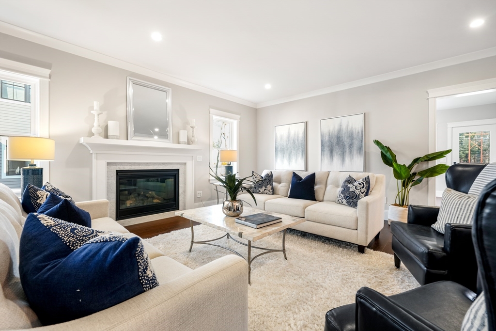 8 Wayside Road Natick, MA 01760 - Photo 11 of 42 a living room with furniture and a fireplace
