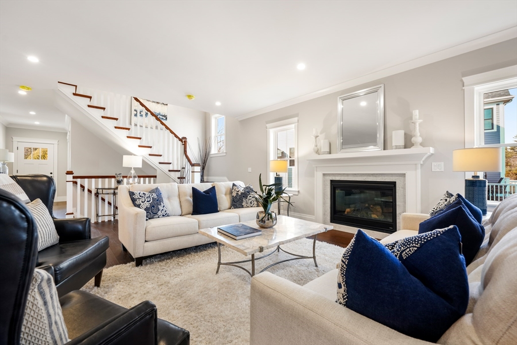 8 Wayside Road Natick, MA 01760 - Photo 12 of 42 a living room with furniture and a fireplace