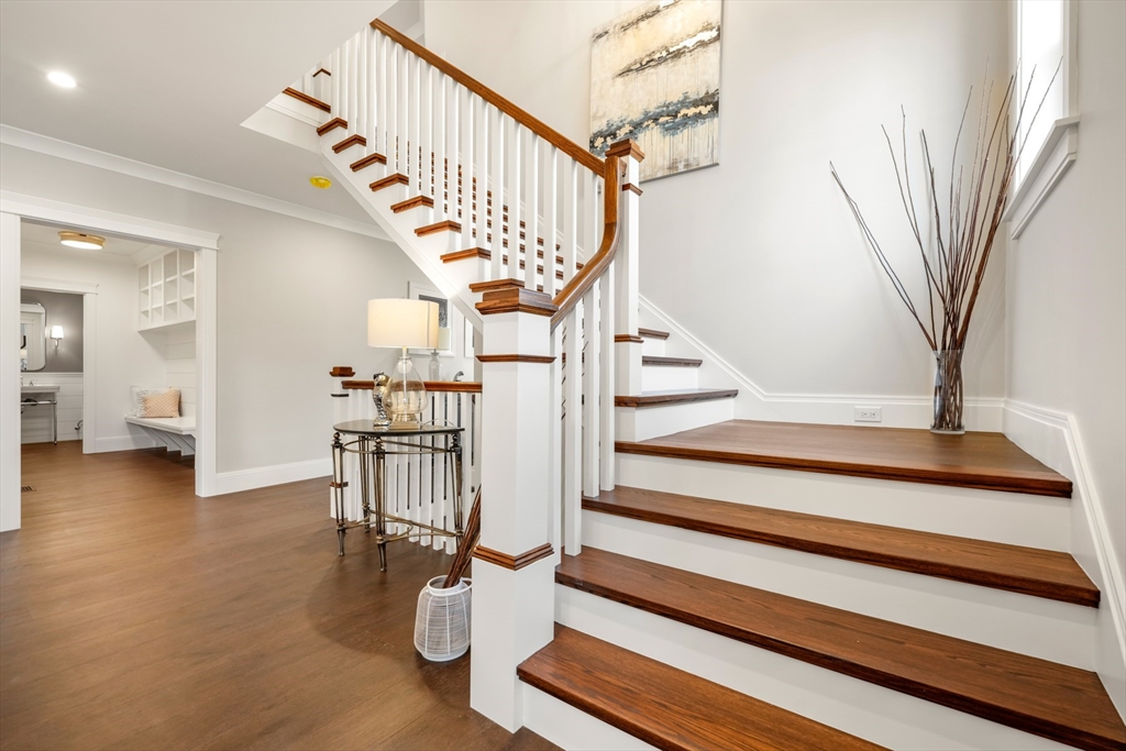 8 Wayside Road Natick, MA 01760 - Photo 13 of 42 a view of entryway livingroom and hall with wooden floor
