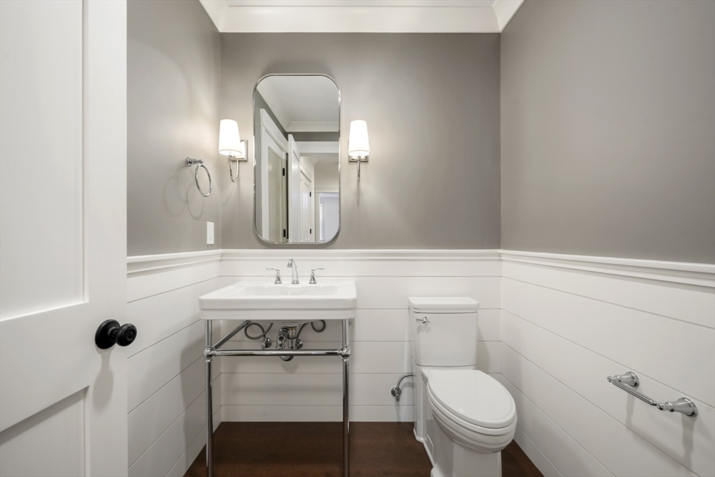 8 Wayside Road Natick, MA 01760 - Photo 18 of 42 a bathroom with a toilet a sink and mirror