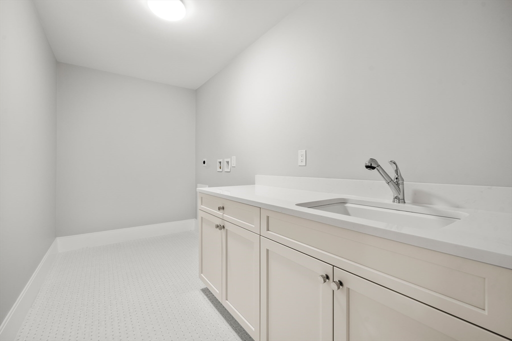 8 Wayside Road Natick, MA 01760 - Photo 27 of 42 a bathroom with a sink and a vanity