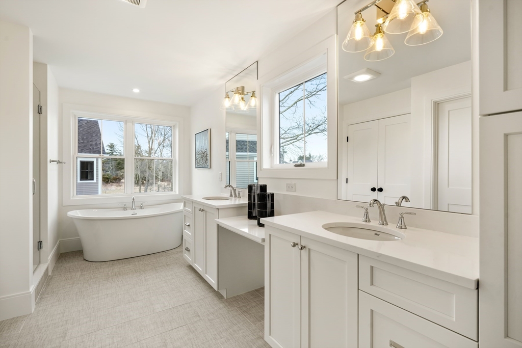 8 Wayside Road Natick, MA 01760 - Photo 32 of 42 a bathroom with a tub sink and mirror