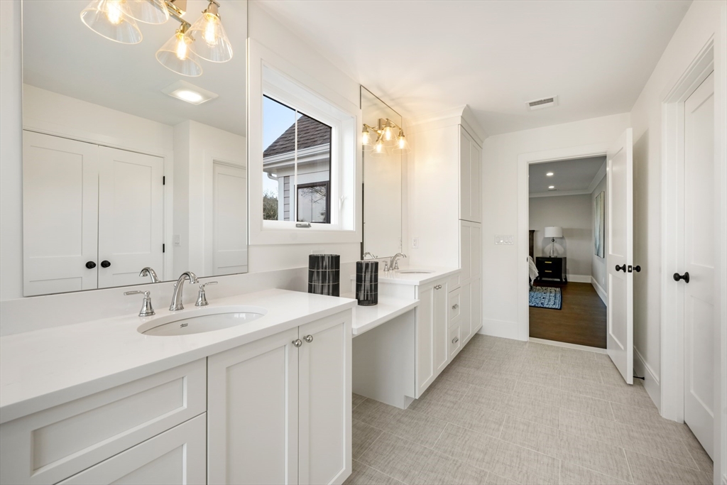 8 Wayside Road Natick, MA 01760 - Photo 34 of 42 a spacious bathroom with a double vanity sink and a mirror