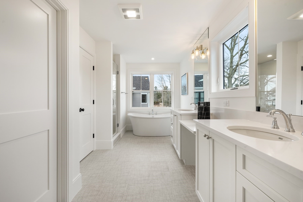 8 Wayside Road Natick, MA 01760 - Photo 35 of 42 a bathroom with a sink a toilet and shower