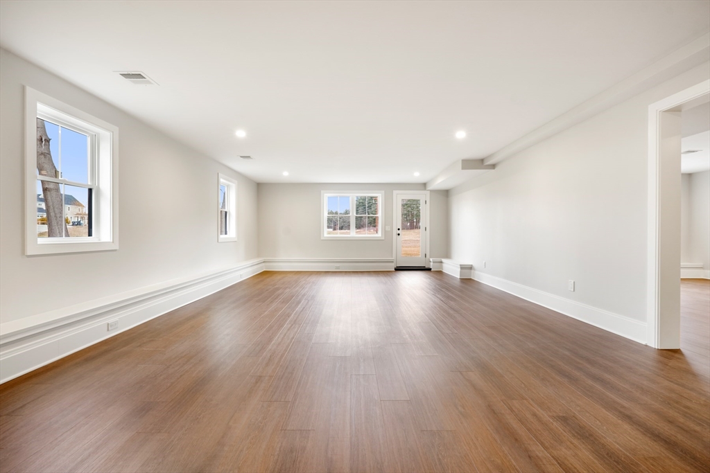 8 Wayside Road Natick, MA 01760 - Photo 36 of 42 a view of empty room with wooden floor and fan