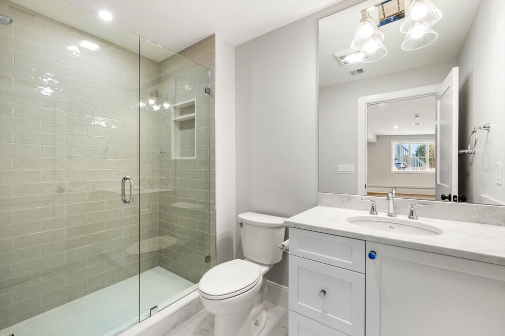 8 Wayside Road Natick, MA 01760 - Photo 41 of 42 a bathroom with a sink a toilet and shower