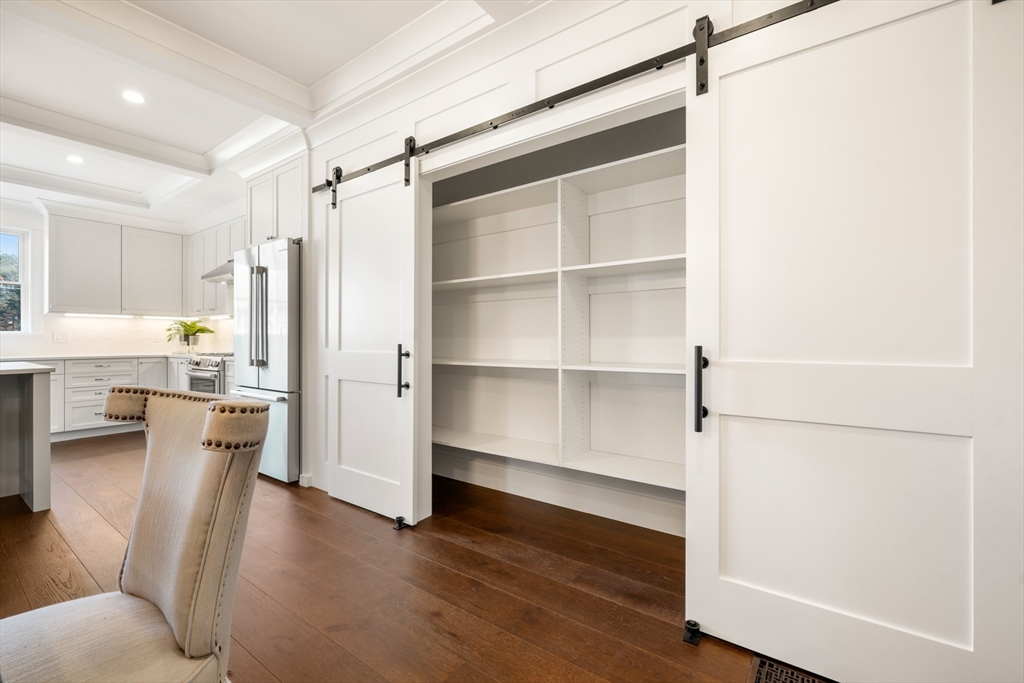 8 Wayside Road Natick, MA 01760 - Photo 9 of 42 a view of empty room with wooden floor and window