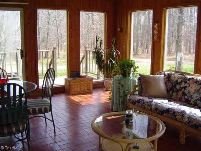 2175 Fuller Mill Road North Thomasville, NC 27360 - Photo 4 of 9 Other. sunroom with brick floor, opens to front and rear porch with patio doors, rear opens to 2 tiered deck and pool.