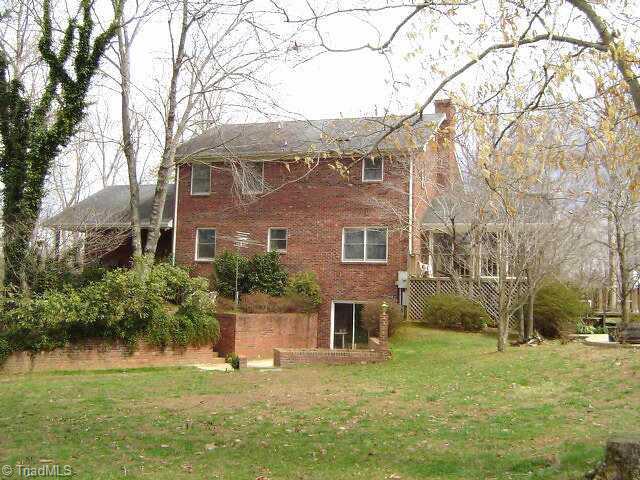 2175 Fuller Mill Road North Thomasville, NC 27360 - Photo 8 of 9 Other. rear view showing, full unfinished basement, partitioned into two separate rooms, has wood heater for low heat bills.