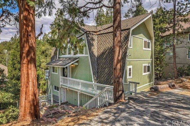 888 Grass Valley Road Lake Arrowhead, CA 92352 - Photo 1 of 1 a backyard of a house with lots of green space