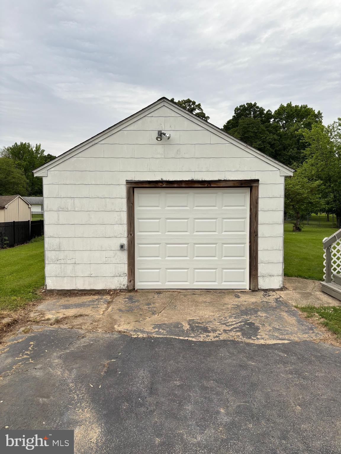 716 Wampler Road Baltimore, MD 21220 - Photo 14 of 21 a front view of a house with a yard and garage