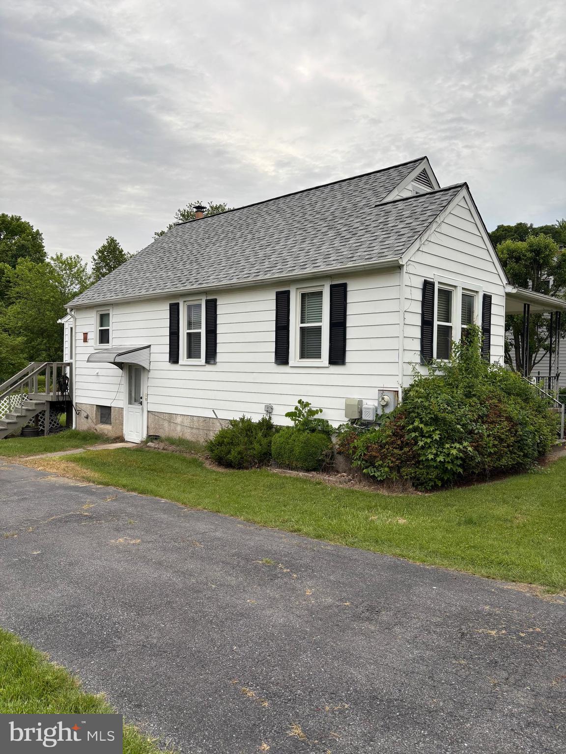 716 Wampler Road Baltimore, MD 21220 - Photo 4 of 21 a front view of a house with a yard and garage