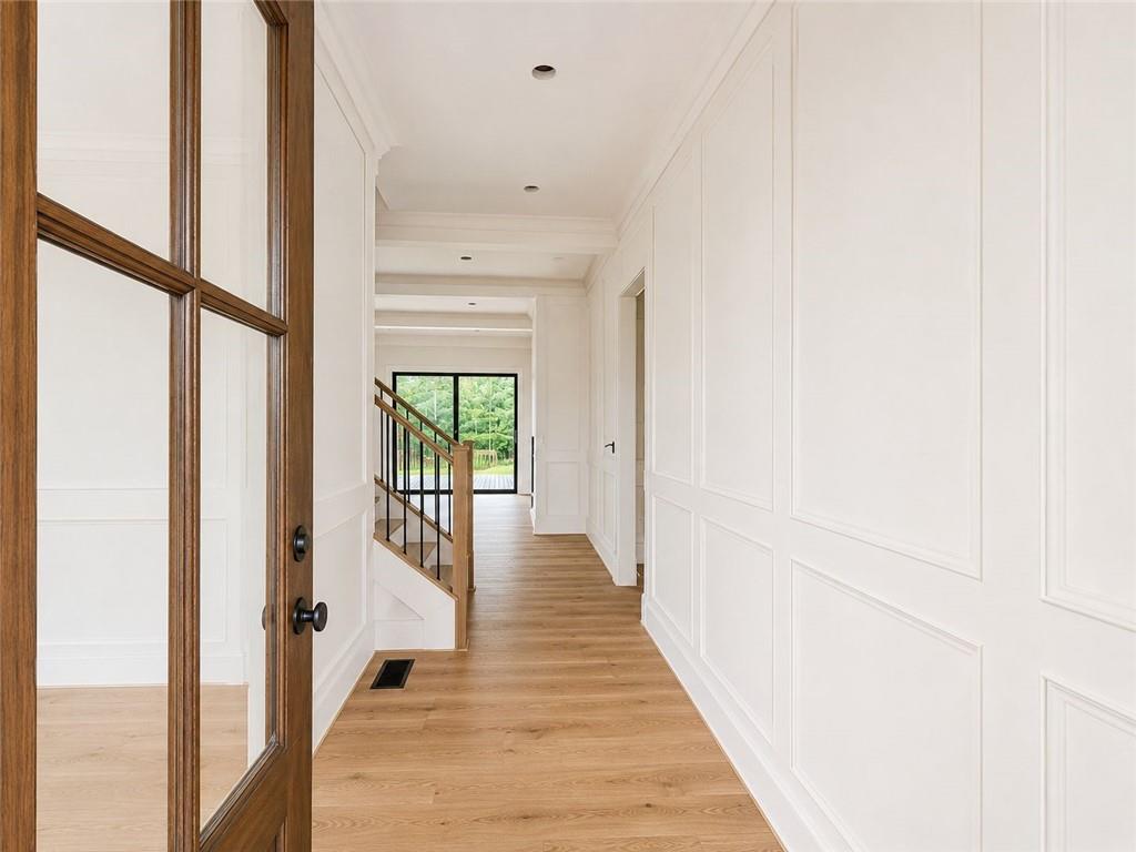 126 Palisade Drive Rydal, GA 30171 - Photo 11 of 36 a view of a hallway with wooden floor and windows