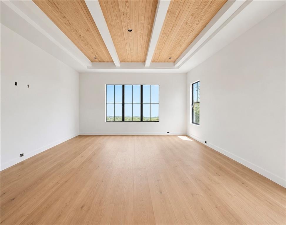 126 Palisade Drive Rydal, GA 30171 - Photo 24 of 36 an empty room with wooden floor and windows