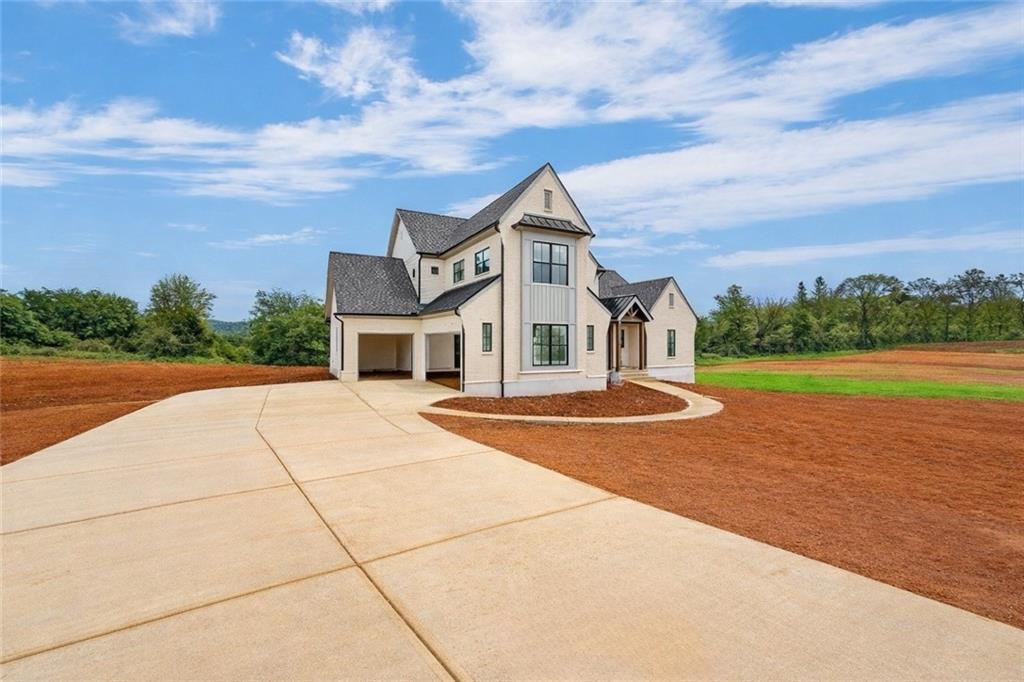126 Palisade Drive Rydal, GA 30171 - Photo 3 of 36 a front view of a house with a yard and trees