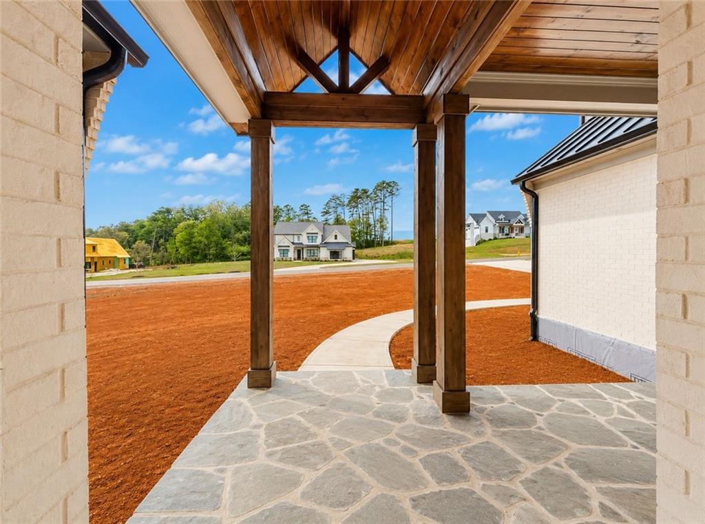 126 Palisade Drive Rydal, GA 30171 - Photo 8 of 36 a view of a patio with a table and chairs