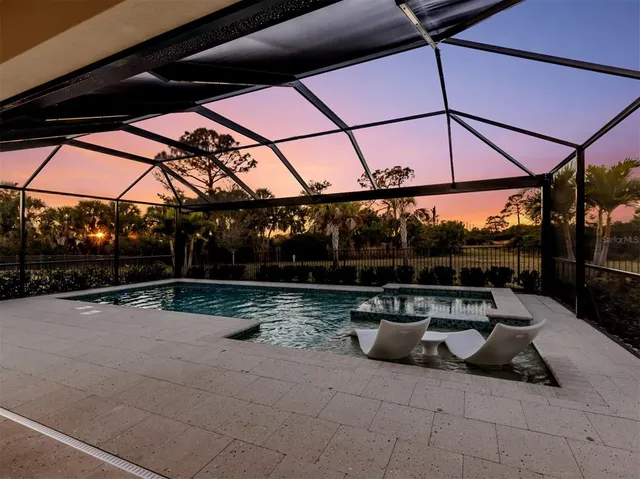 a view of swimming pool with a patio