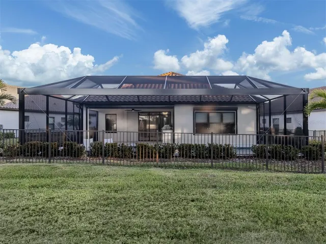 a view of a house next to a yard