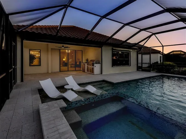 a view of a patio with table and chairs with wooden floor