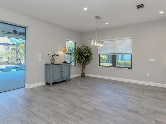 an empty room with windows and entrance