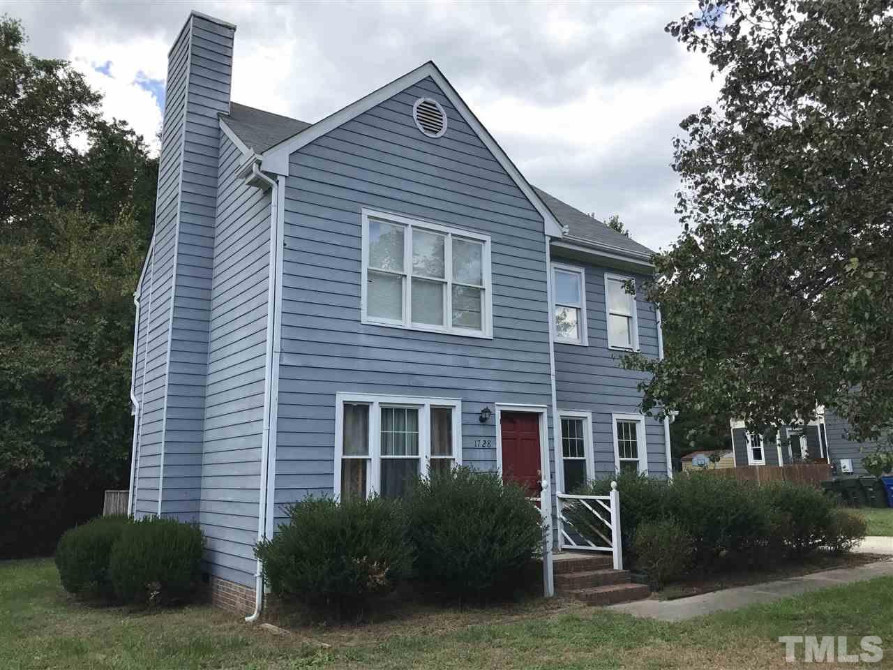 1728 Vintage Road Raleigh, NC 27610 - Photo 1 of 16 a front view of a house with a garden