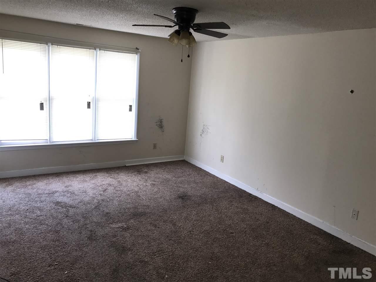 1728 Vintage Road Raleigh, NC 27610 - Photo 11 of 16 an empty room with a window