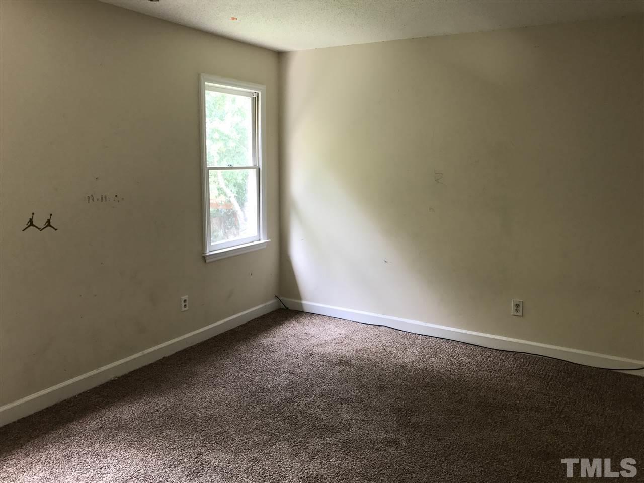 1728 Vintage Road Raleigh, NC 27610 - Photo 13 of 16 an empty room with a window
