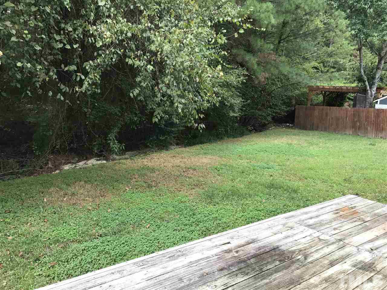 1728 Vintage Road Raleigh, NC 27610 - Photo 15 of 16 a view of a backyard with a trees