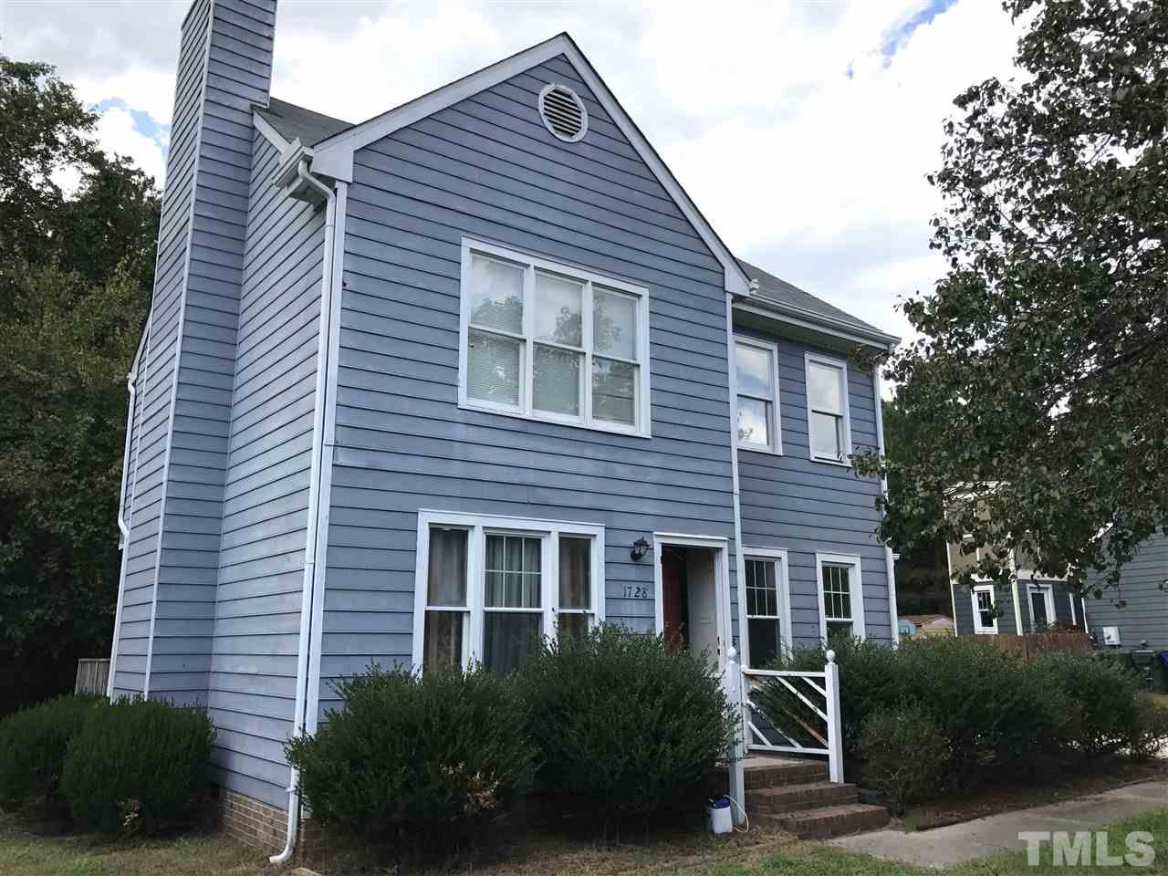 1728 Vintage Road Raleigh, NC 27610 - Photo 2 of 16 a front view of a house with a yard
