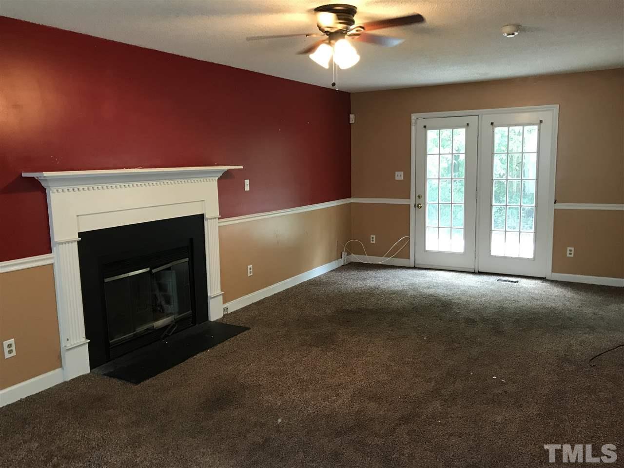 1728 Vintage Road Raleigh, NC 27610 - Photo 9 of 16 a view of empty room with a fireplace