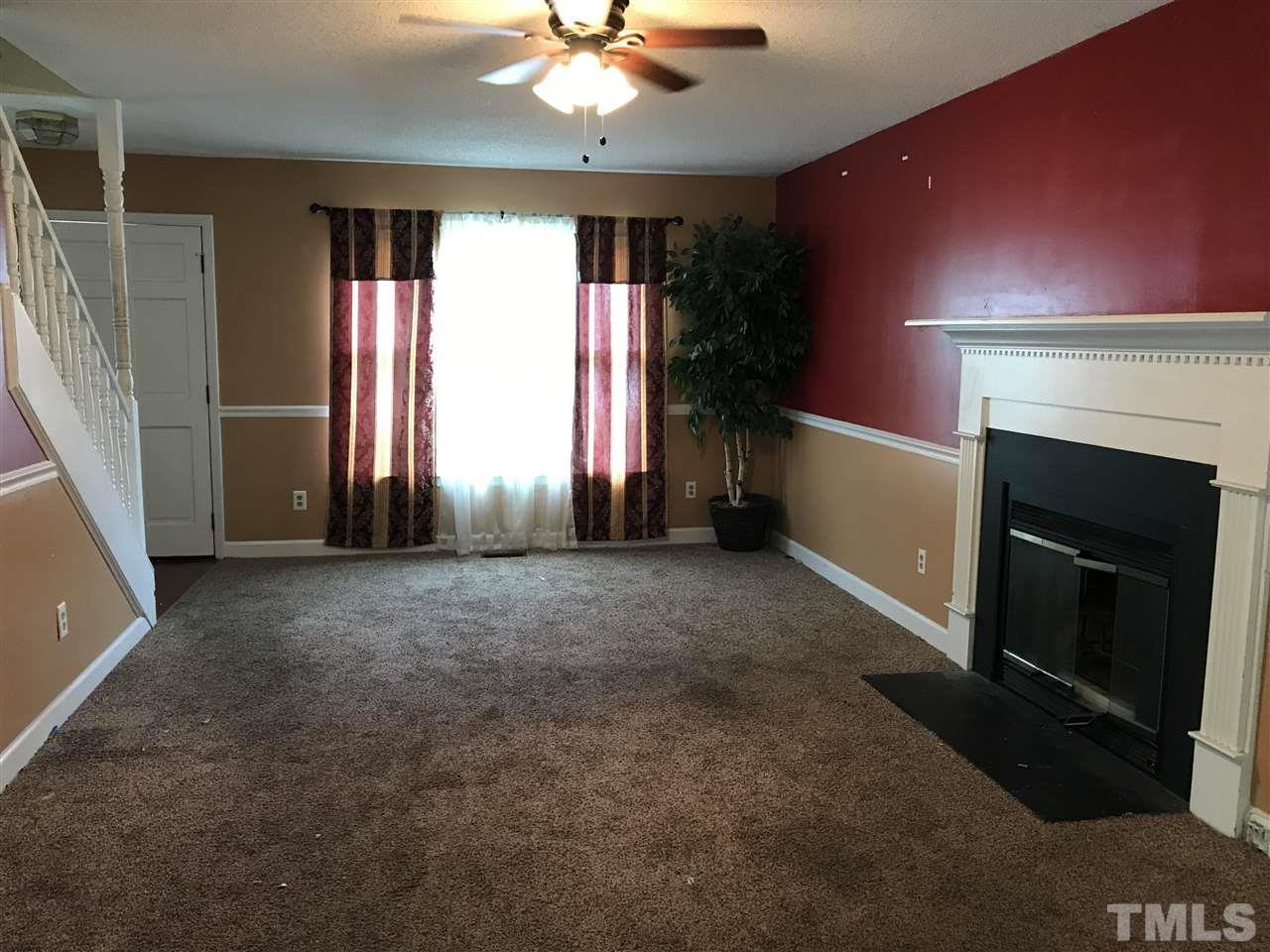 1728 Vintage Road Raleigh, NC 27610 - Photo 10 of 16 a view of an empty room with a fireplace