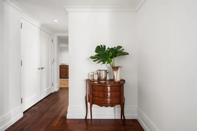 a kitchen with a sink appliances and cabinets