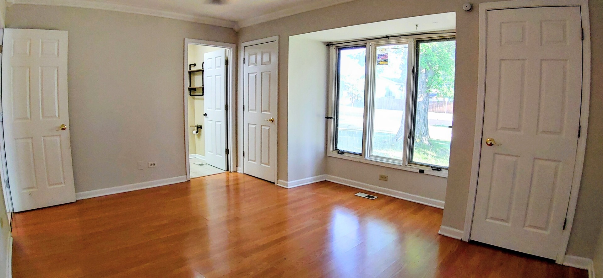 1160 Hassell Road Hoffman Estates, IL 60169 - Photo 13 of 24 an empty room with wooden floor and windows