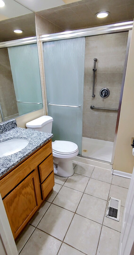 1160 Hassell Road Hoffman Estates, IL 60169 - Photo 17 of 24 a bathroom with a granite countertop sink and a mirror